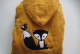 Poncho met logo geborduurd