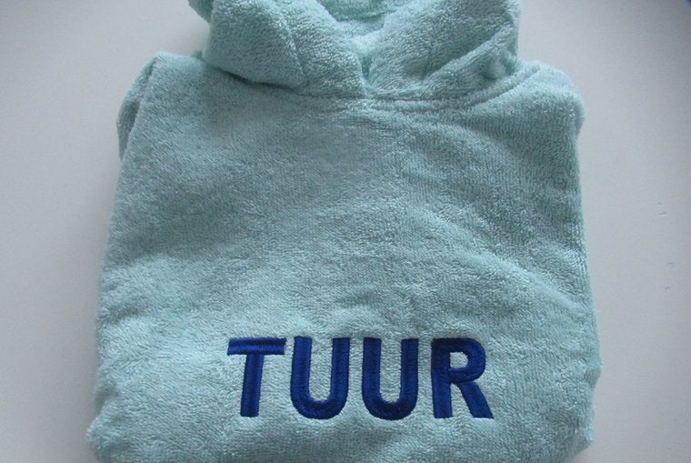 Poncho geborduurd met naam